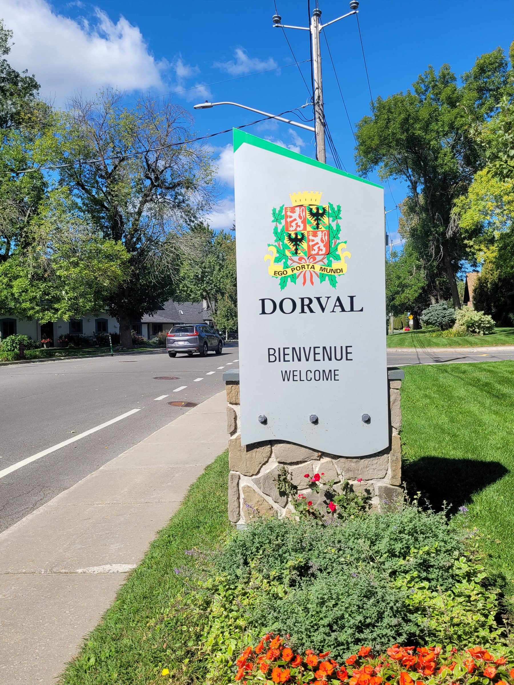 Dorval welcome sign on a tree-lined residential street