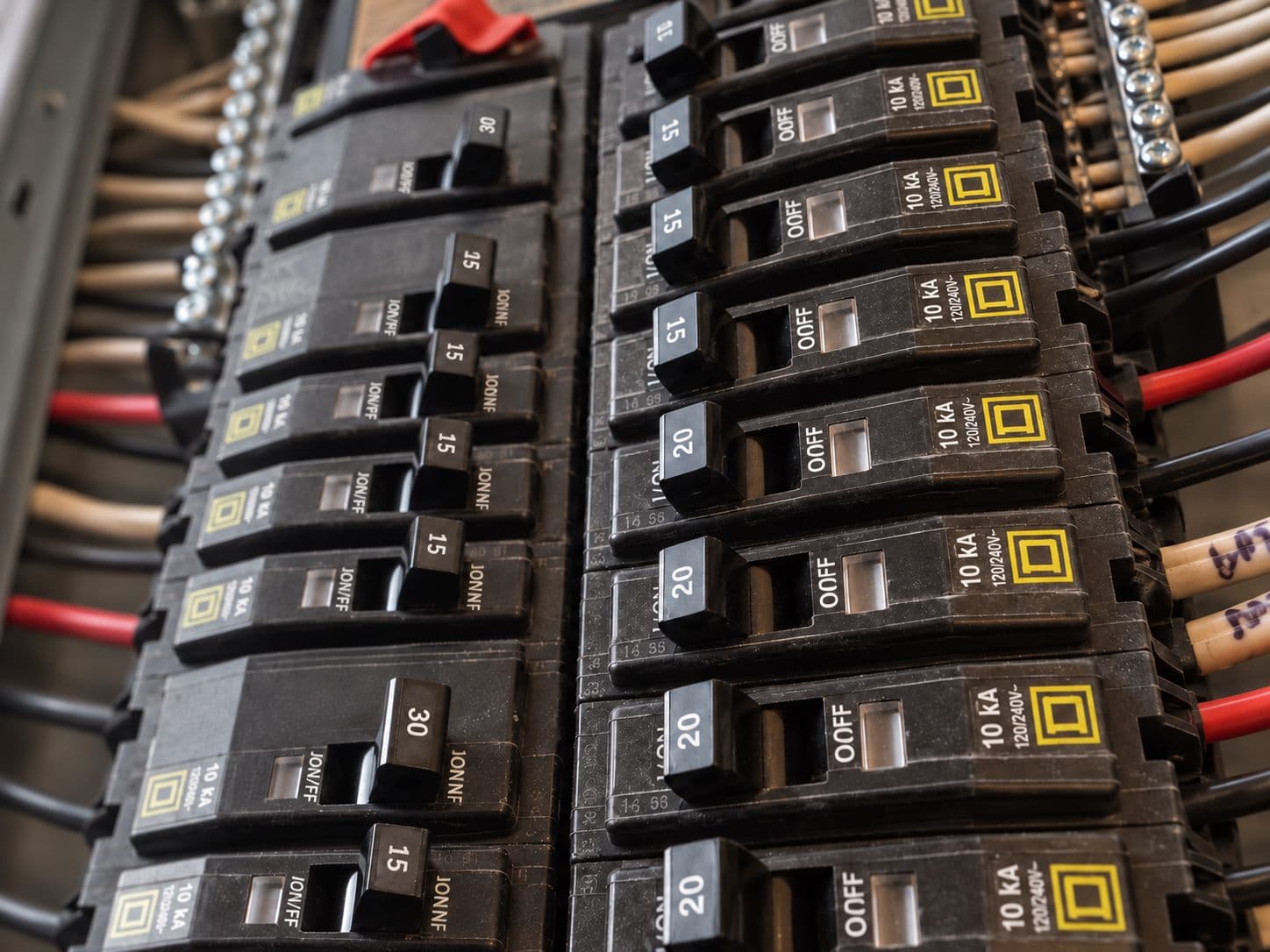Close view of circuit breakers in a residential electrical panel